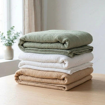 Mousselia™ – La couverture en mousseline de coton qui vous enveloppe de douceur