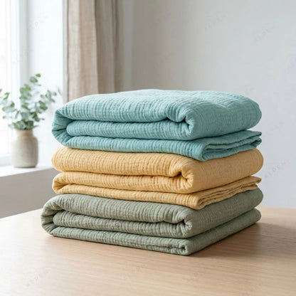 Mousselia™ – La couverture en mousseline de coton qui vous enveloppe de douceur