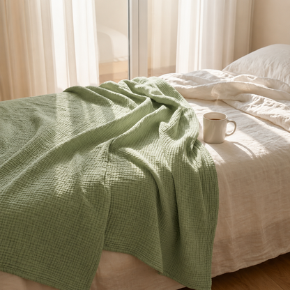 Mousselia™ – La couverture en mousseline de coton qui vous enveloppe de douceur