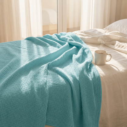 Mousselia™ – La couverture en mousseline de coton qui vous enveloppe de douceur